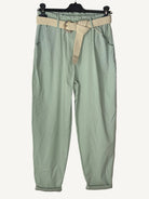 Green pants with a belt on a hanger 
