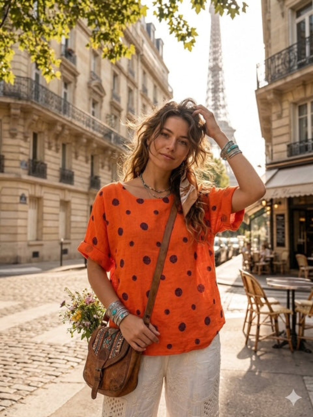 woman wearing orange polka dot cotton top