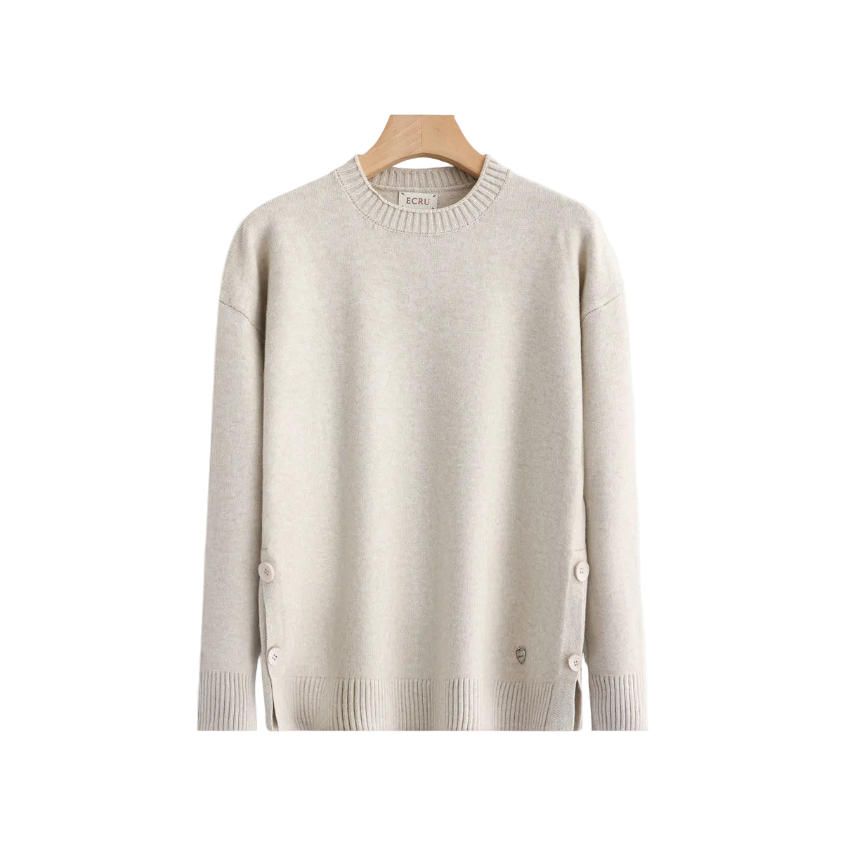 A light beige crewneck sweater hanging on a wooden hanger 