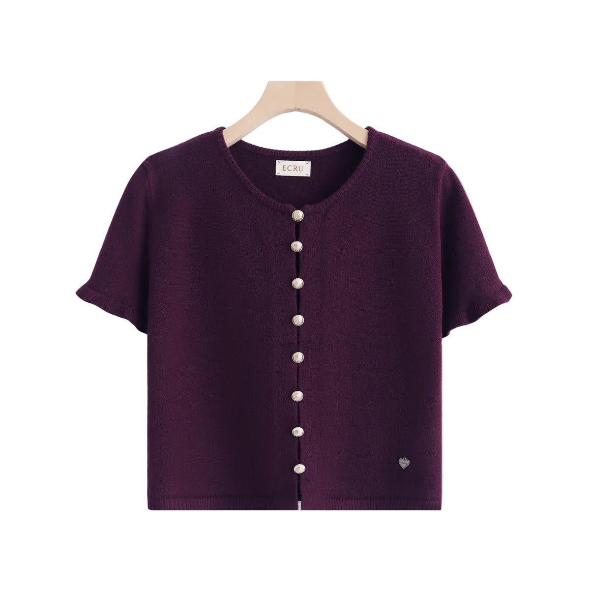 A short-sleeve knit top in deep plum purple, hanging on a wooden hanger against a plain white background. The top features a round neckline, a front button closure with buttons, and a small heart detail near the lower right hem.