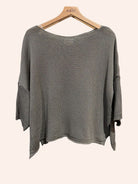 Taupe sweater on a hanger 