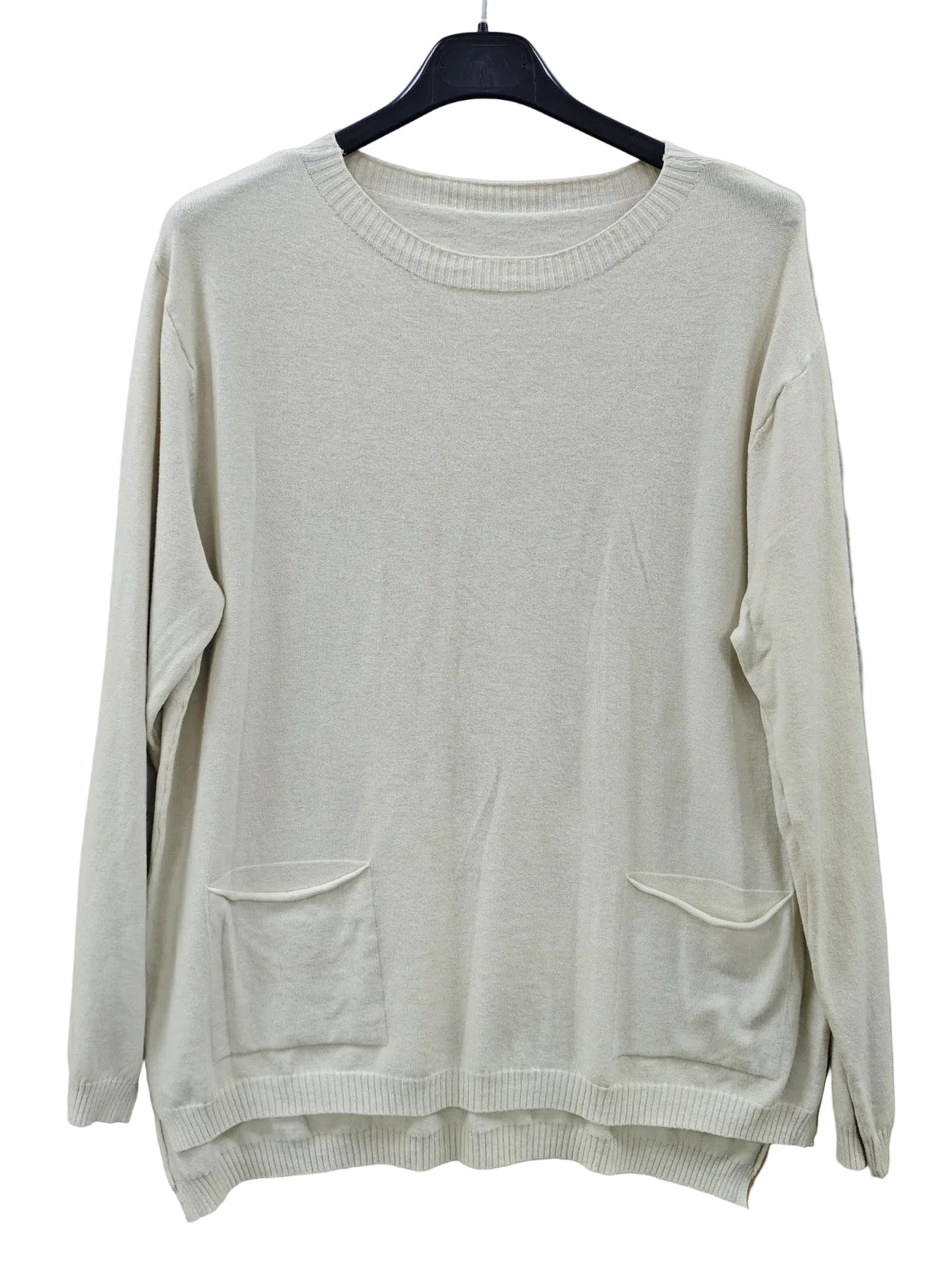 A cream-colored long-sleeve knit sweater with two front patch pockets, hanging on a black hanger