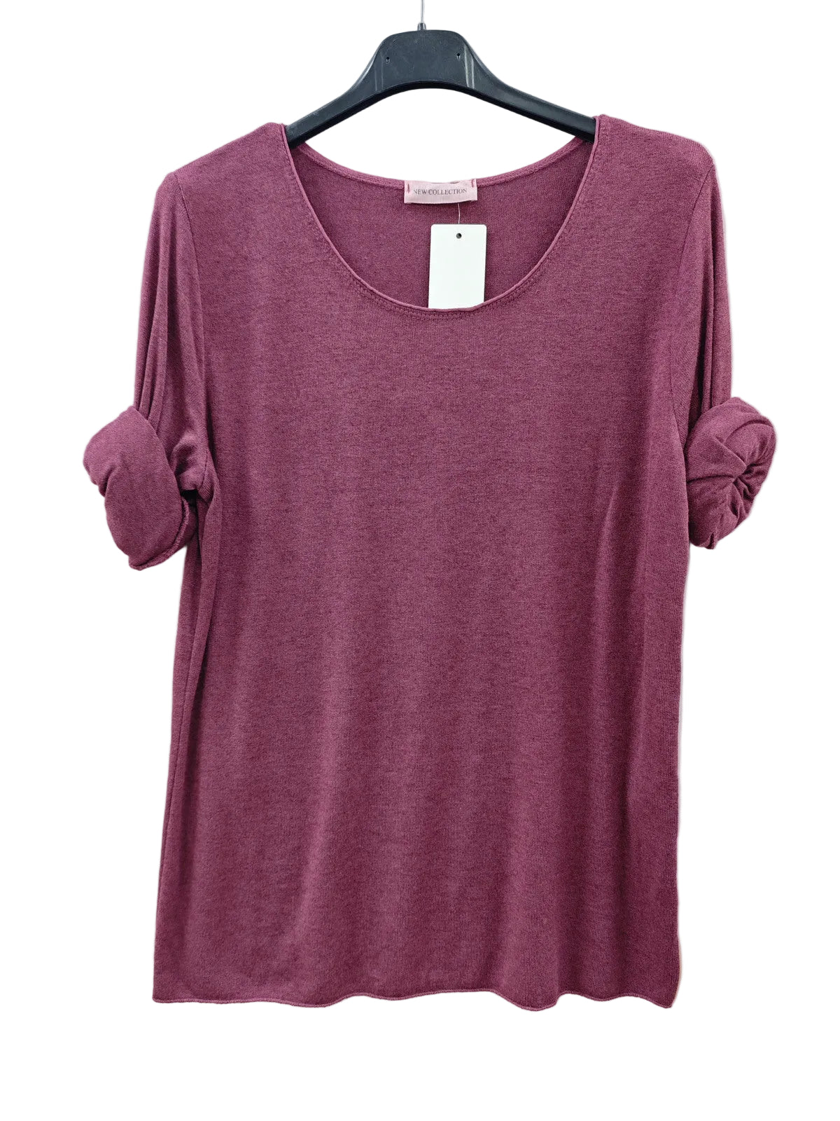 A heathered dusty rose long-sleeve top with rolled-up sleeves, hanging on a black hanger 