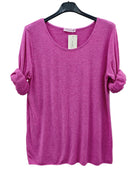 A bright pink heathered knit top with a wide scoop neckline and rolled sleeves