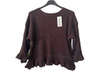 A dark brown knit sweater with three-quarter bell sleeves and a ruffled hem, 