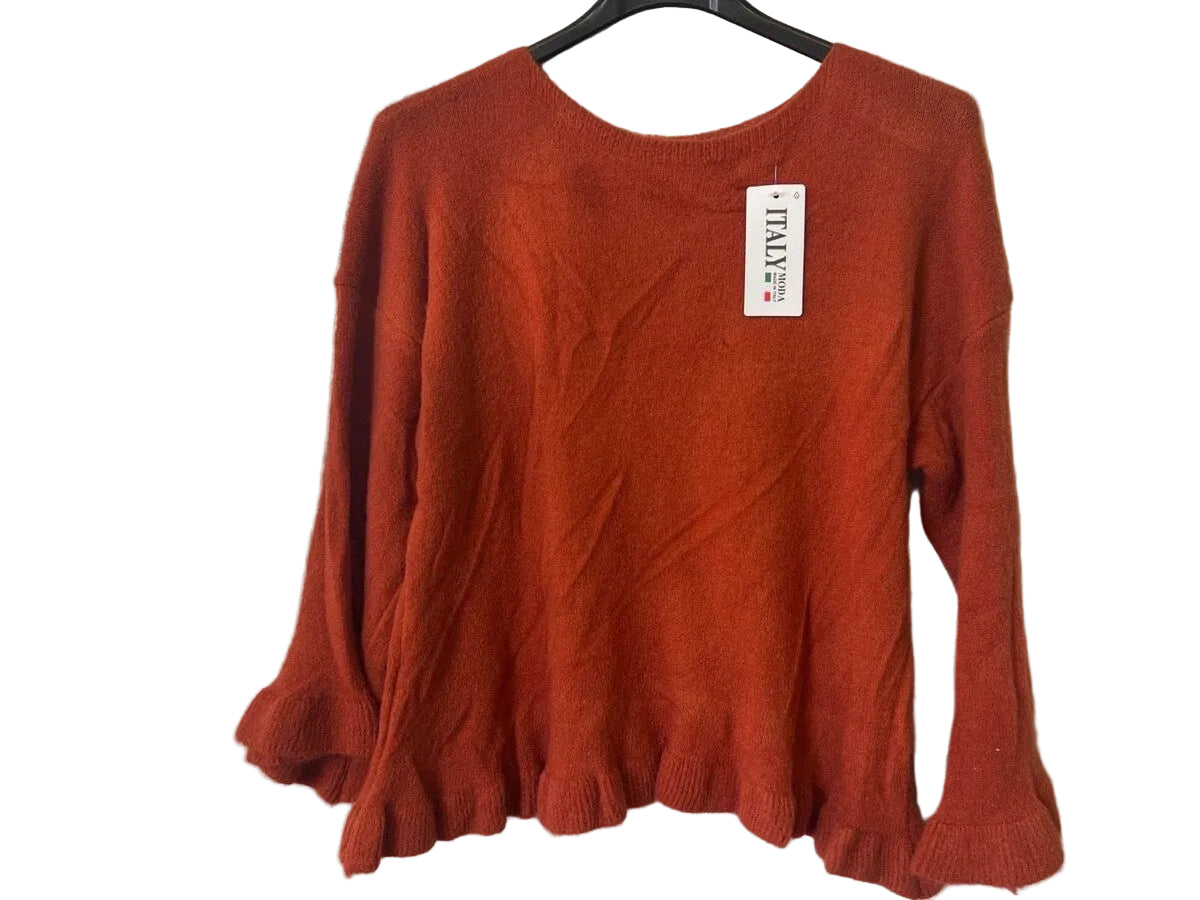A rust-orange knit sweater with long sleeves and a ruffled hem,