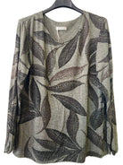 A women's long-sleeve top with an all-over abstract leaf pattern in shades of grey, brown, and black on a soft khaki colour