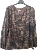 A women's long-sleeve top with a brown and black paisley floral pattern,
