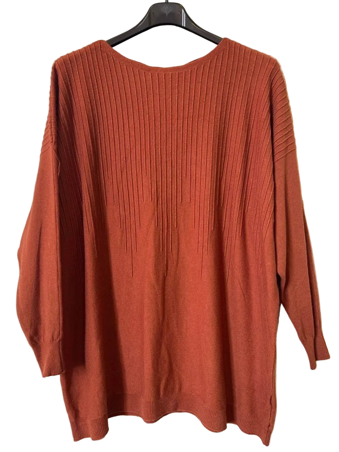 A rust-orange ribbed knit sweater 