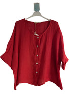 A red one size pure linen button fronted collarless shirt 