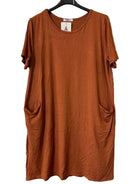 A rust-orange short-sleeve tunic dress with side pockets