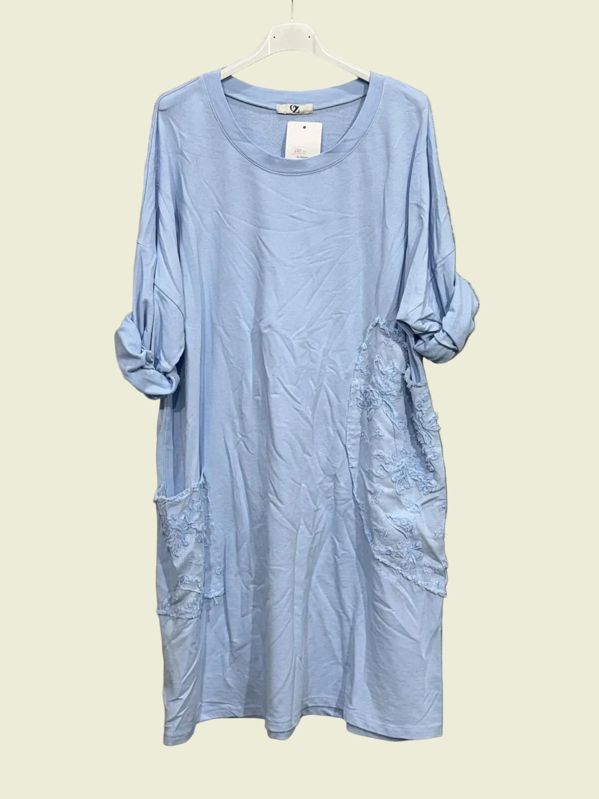 Light blue dress on a hanger 