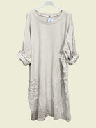 Ecru dress on a hanger 