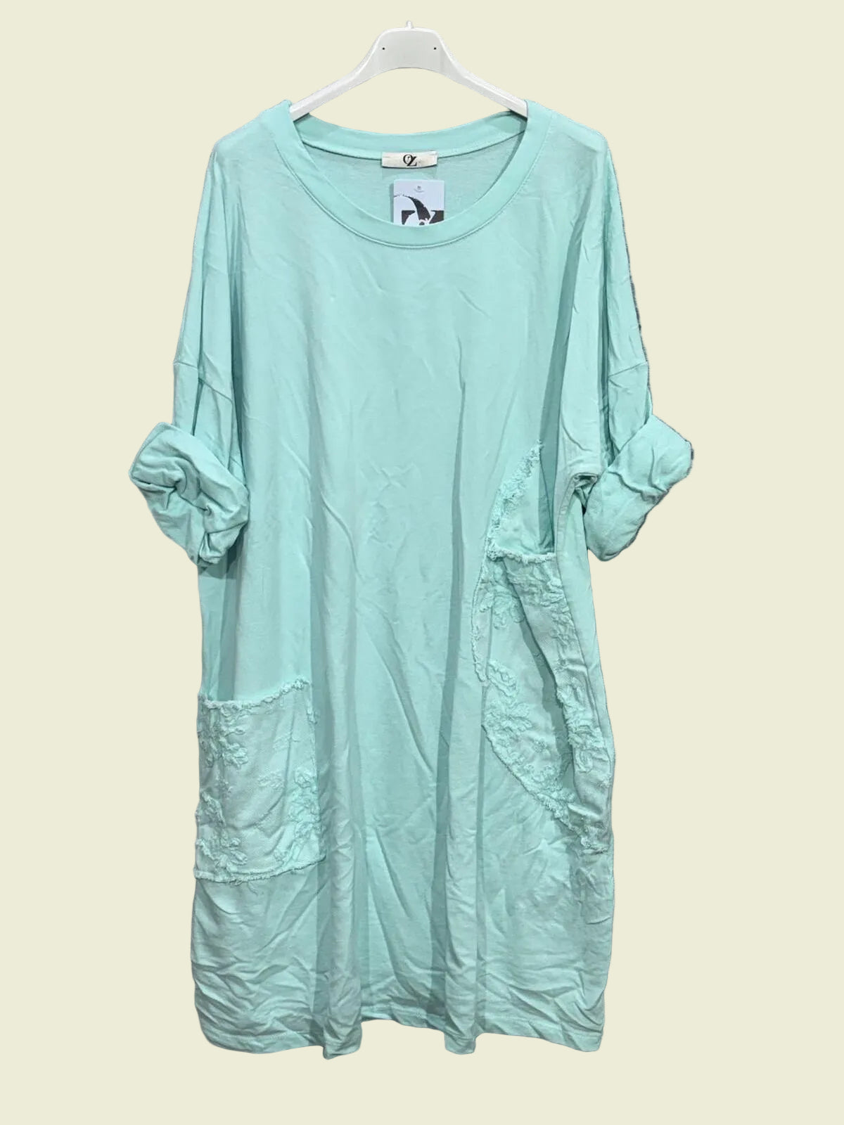 Vert D'Eau dress on a hanger 