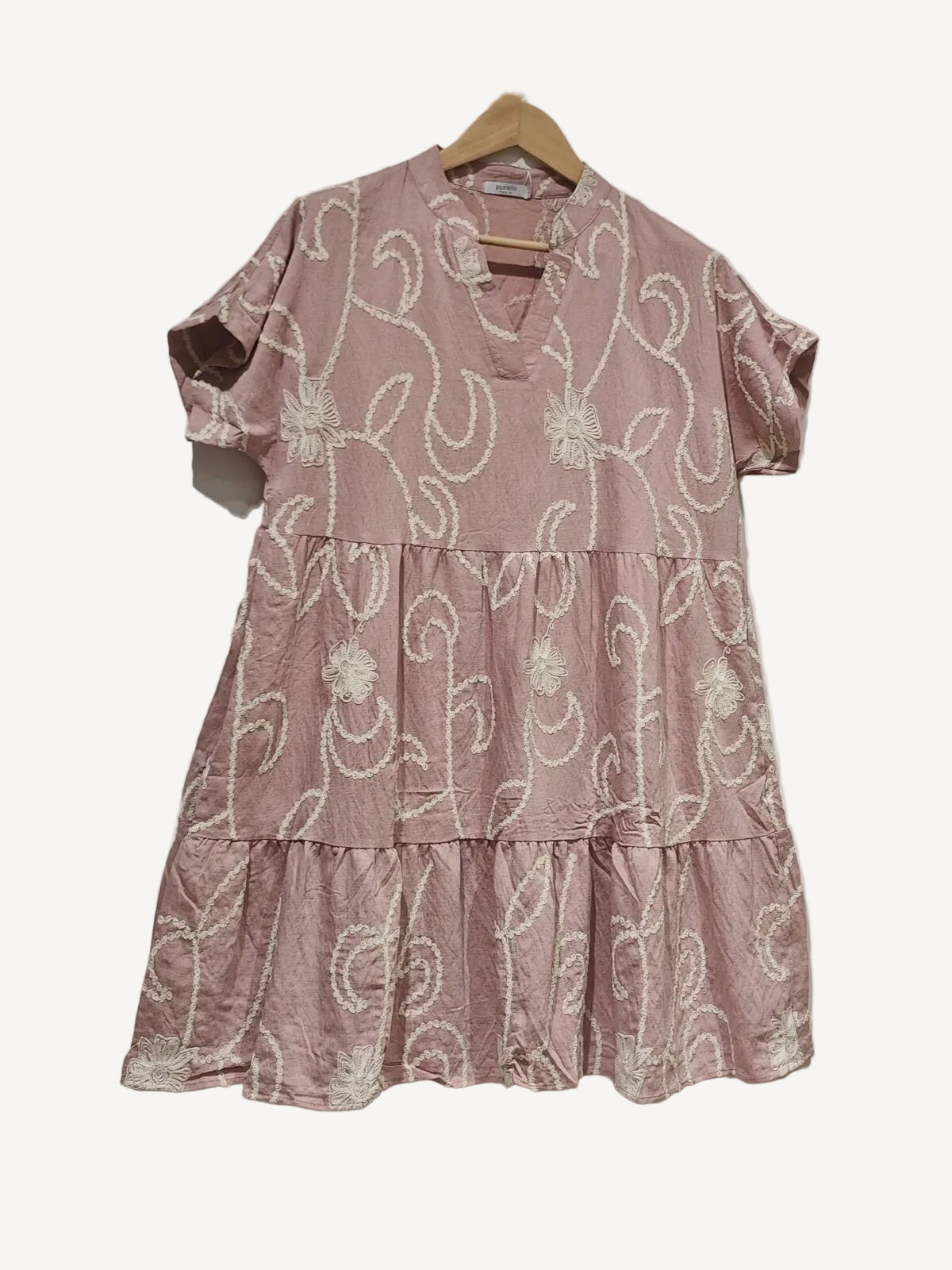 Rose pink tiered dress on a white background