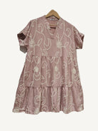 Rose pink tiered dress on a white background