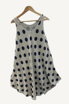 Beige sleeveless polka dot dress