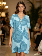 Woman wearing a blue patterned dress at an event
