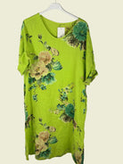 Green floral dress on a hanger 