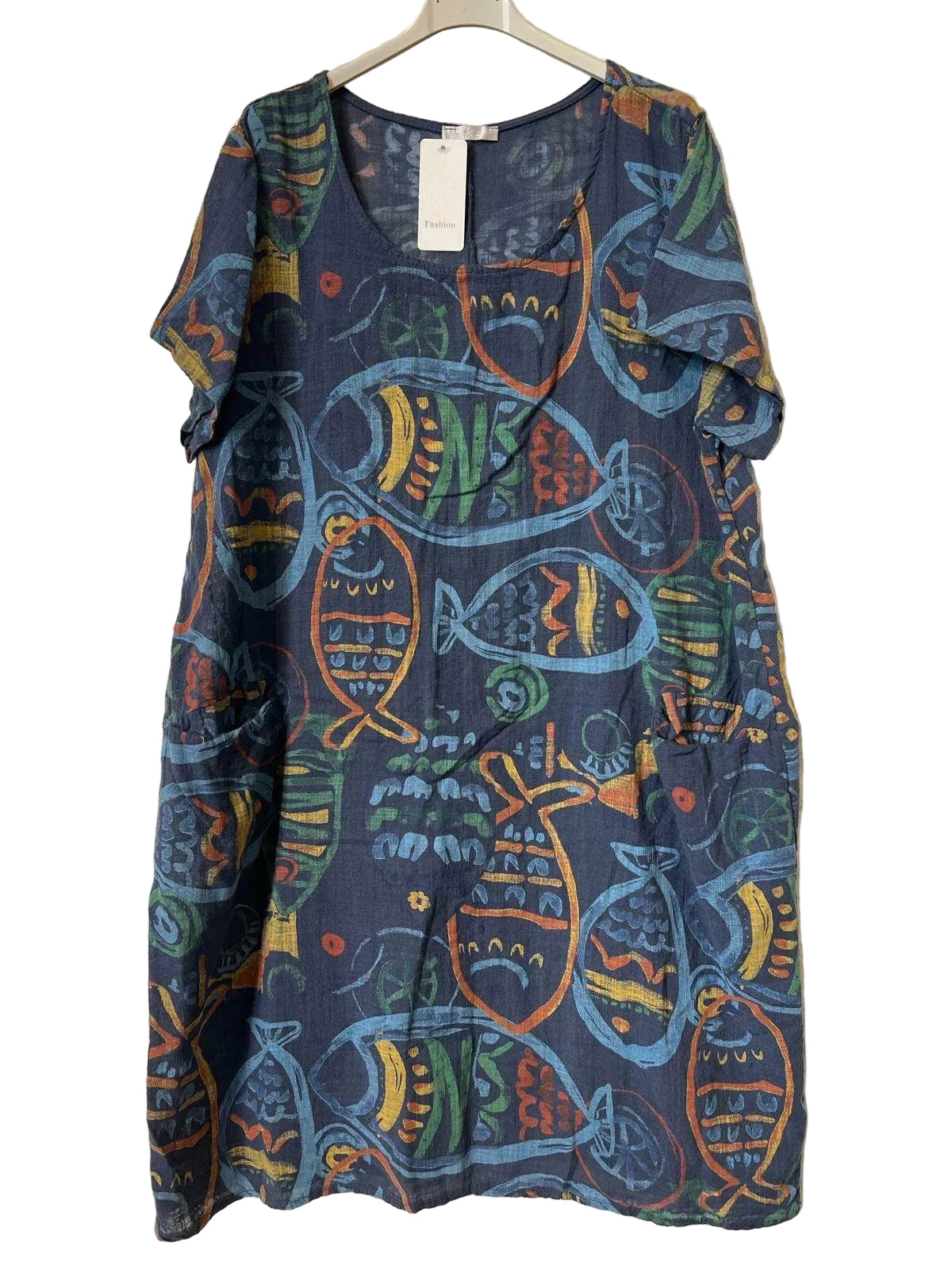 A short-sleeve V-neck dress with a colorful fish pattern on a dark blue base, hanging on a white hanger against a textured gray background.