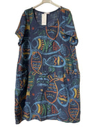 A short-sleeve V-neck dress with a colorful fish pattern on a dark blue base, hanging on a white hanger against a textured gray background.