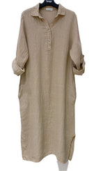 Beige long-sleeve dress on a hanger against a white background