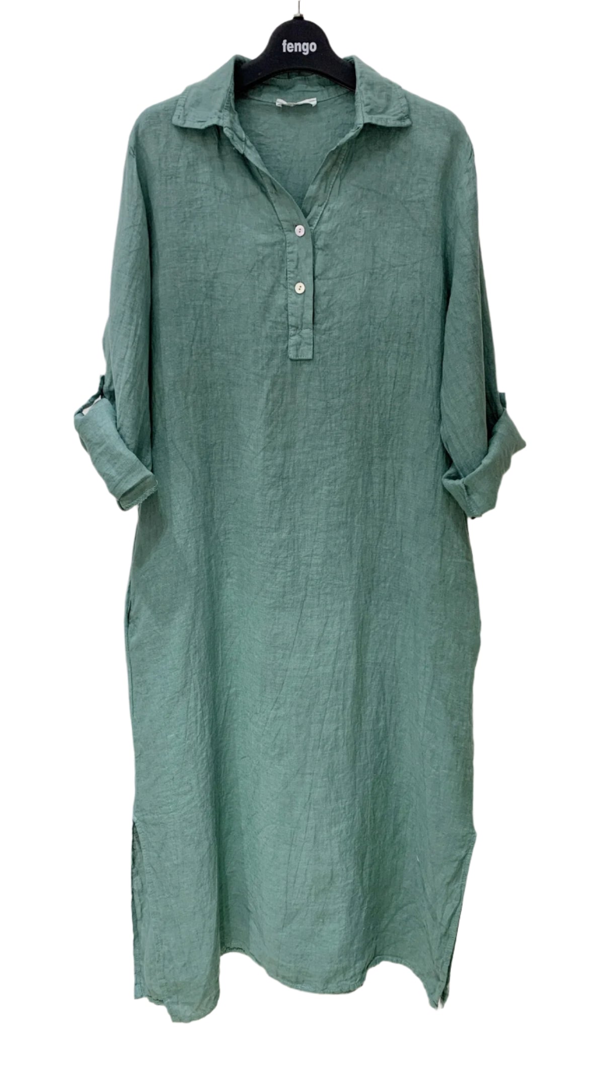 Green dress on a hanger against a white background