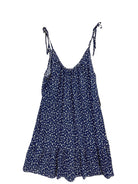 A navy blue sleeveless slip dress with a small white floral print