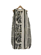Sleeveless dress with khaki abstract patterns on a hanger against a plain background
