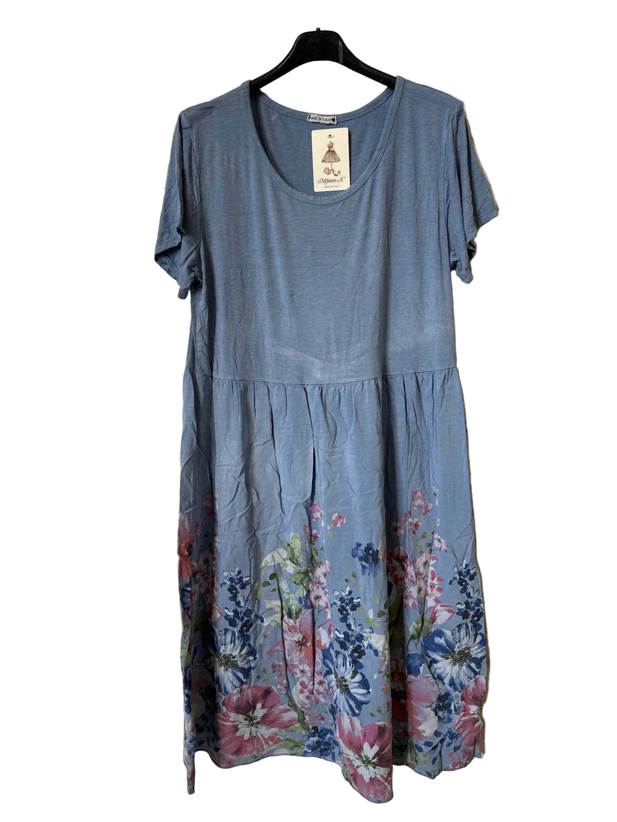 A short-sleeve blue dress with a tiered waist and a pink, purple, and blue floral print along the hem