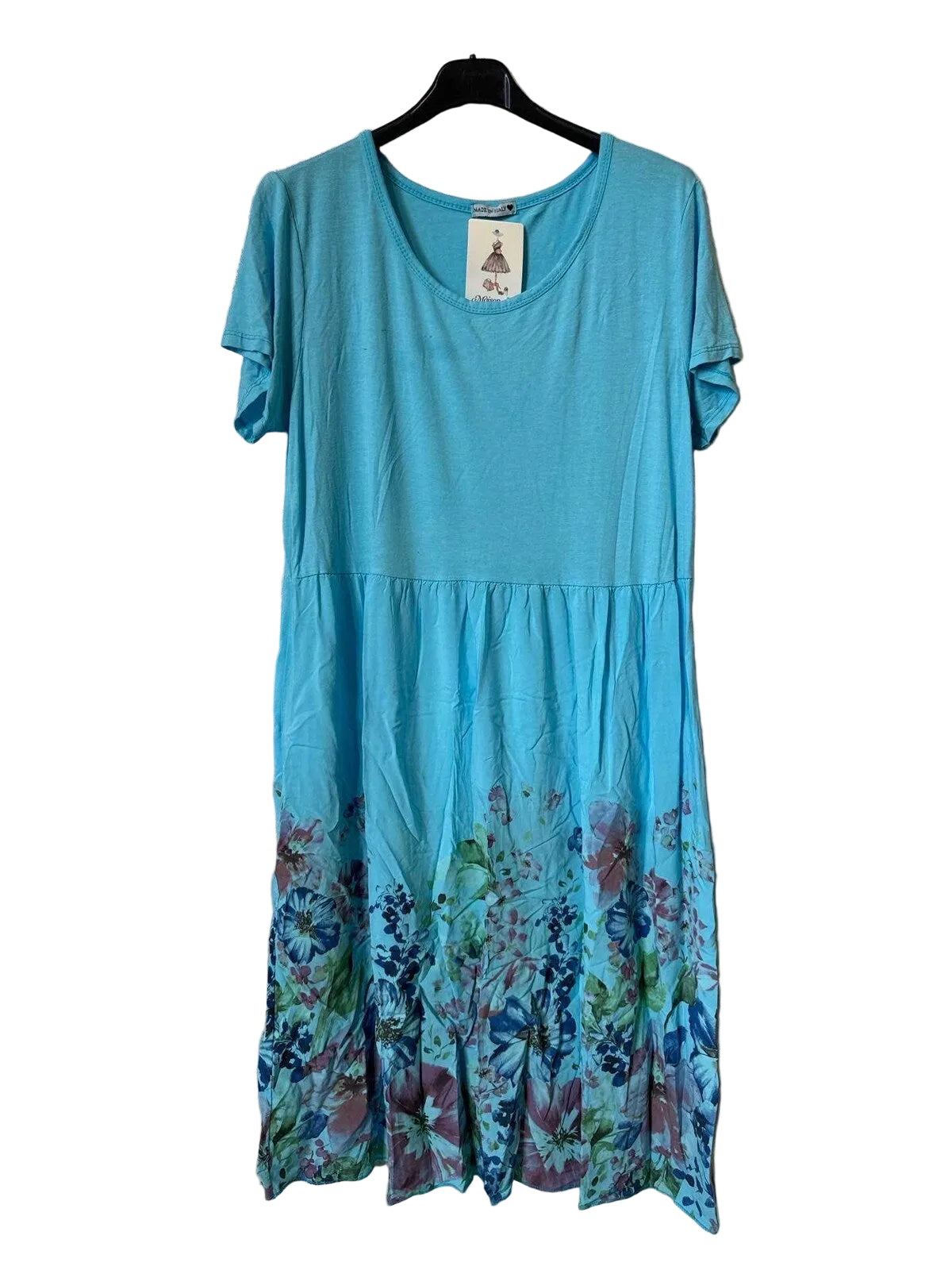 A short-sleeve A-line dress in bright turquoise blue, featuring a floral print concentrated along the bottom hem. 