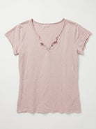 A light pink short-sleeve V-neck t-shirt with a raw hem, laid flat against a light gray background.