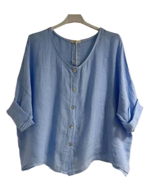 Sky blue shirt on a hanger against a white background