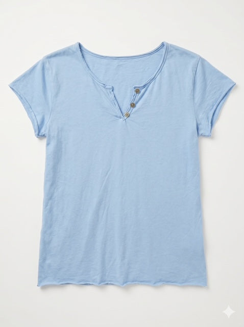 A light blue short-sleeve henley t-shirt with three brown buttons on the chest, laid flat against a light off-white background.