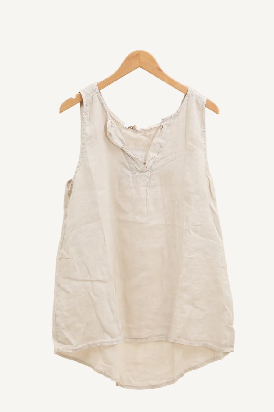 Beige sleeveless top on a hanger 