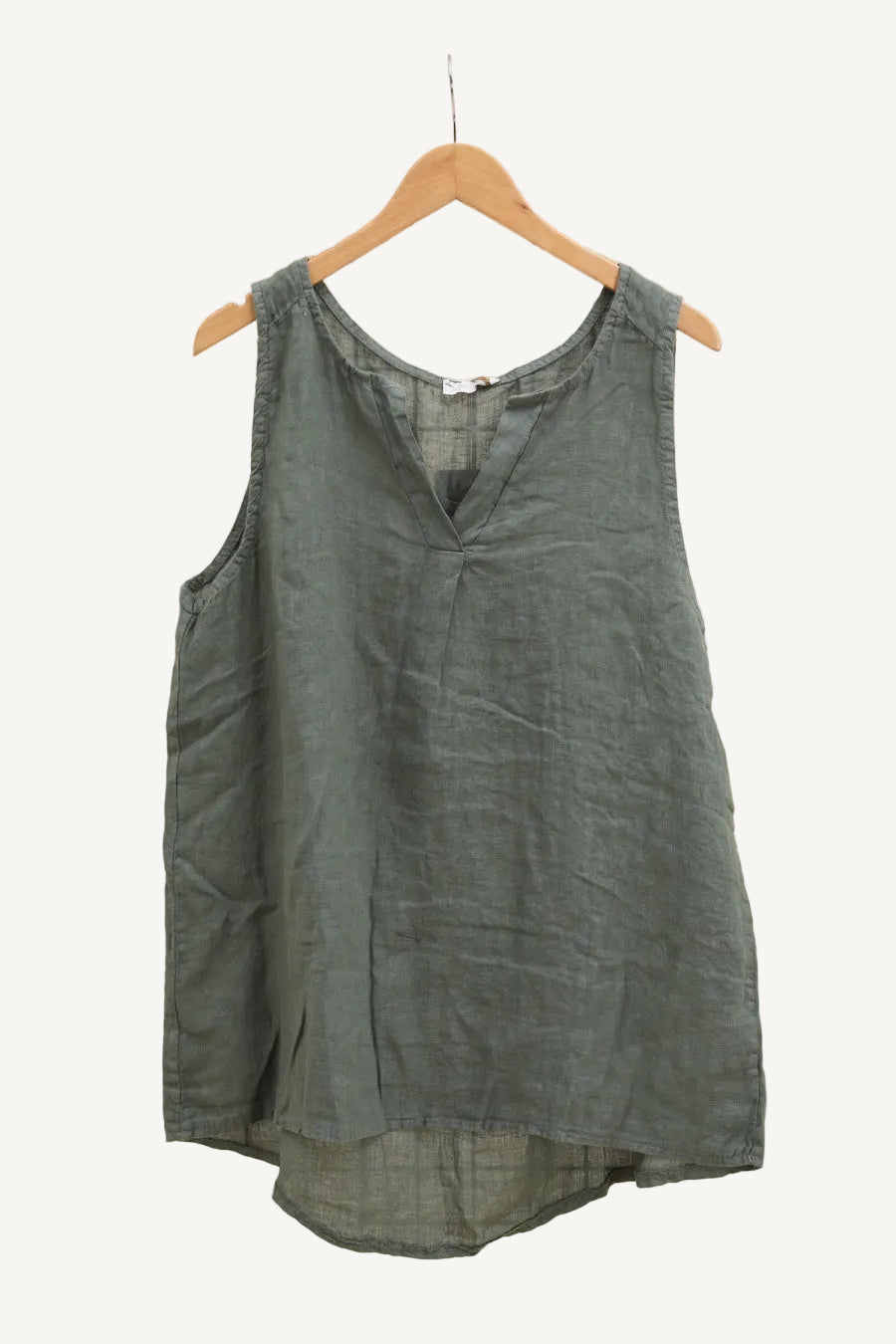 Green sleeveless top on a hanger 
