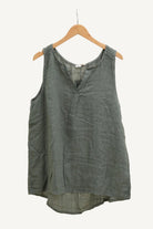 Green sleeveless top on a hanger 