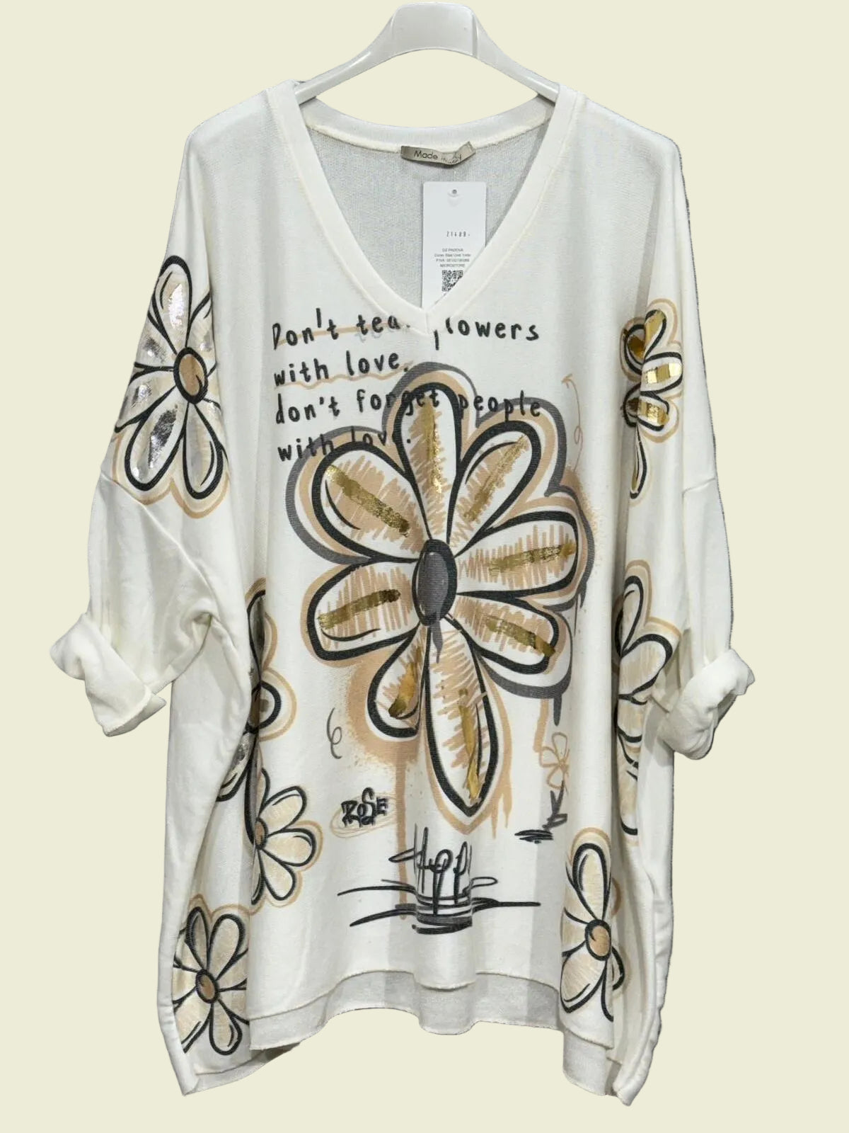 White top with floral designs 