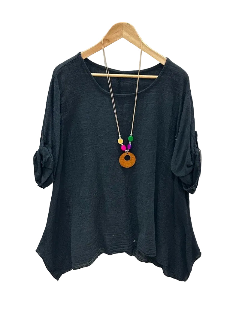 A black long-sleeve top with rolled cuffs, 