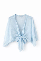 Light blue bolero with a knot detail on a white background