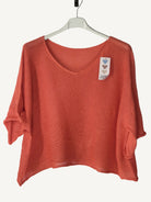 Orange sweater with a v neck 