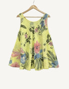 Yellow floral tank top on a wooden hanger 