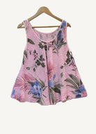 Pink floral sleeveless top on a hanger 