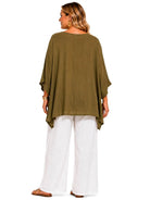 A woman shown from the back wearing an olive green draped top with wide three-quarter sleeves, paired with white wide-leg pants and brown flat sandals, against a plain white background.