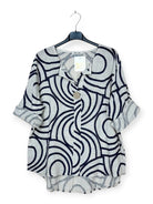 Printed beige top with v nec and feature button