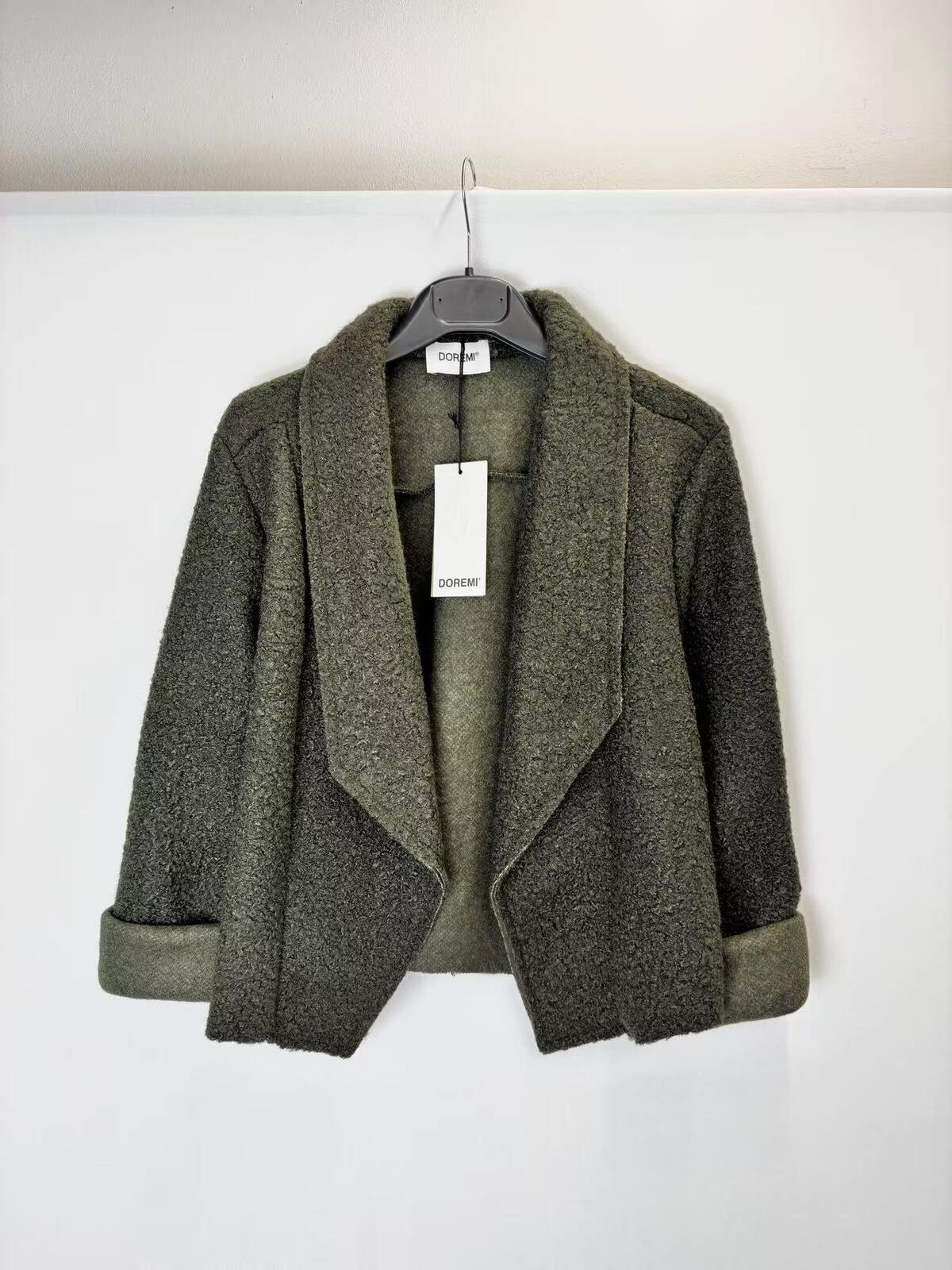 A dark olive green textured open-front jacket with wide lapels