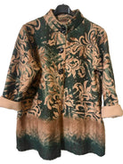 A women's three-quarter sleeve jacket with a mandarin collar, featuring a dark green and brown damask pattern with a gradient fade at the hem, hanging on a black hanger against a textured gray wall.