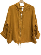 Mustard yellow hooded jacket on a hanger against a white wall.