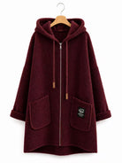 A burgundy sherpa fleece zip-up hoodie with a hood, drawstrings, and front pockets, hanging on a wooden hanger against a white background.