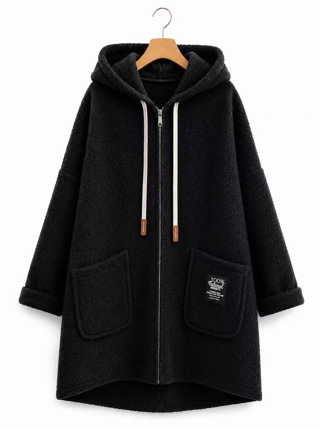 A black fleece zip-up hoodie coat with a hood, white drawstrings, and two front patch pockets, hanging on a wooden hanger against a plain white background.